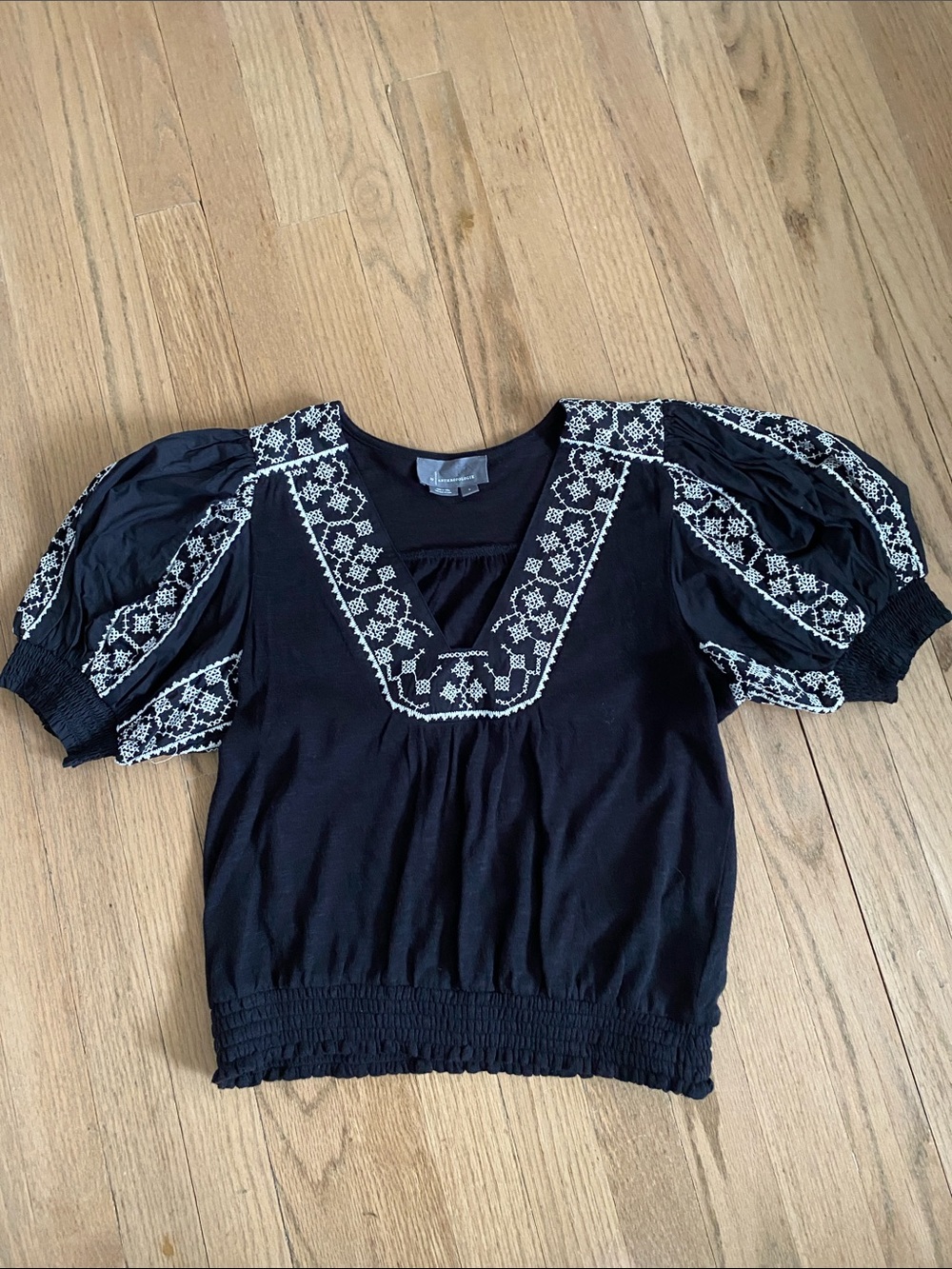 Anthropologie Black Top with White Embroidered Trim